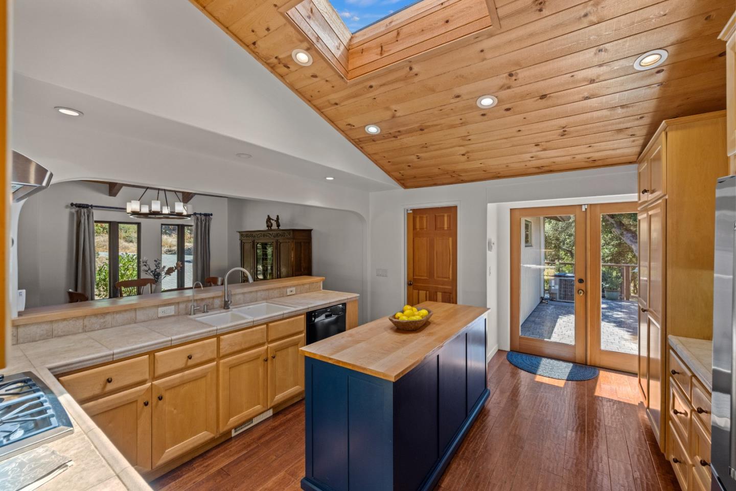 11660 McCarthy Road Carmel Valley, CA 93924 - Photo 8 of 21 a kitchen with a stove a sink and wooden cabinets