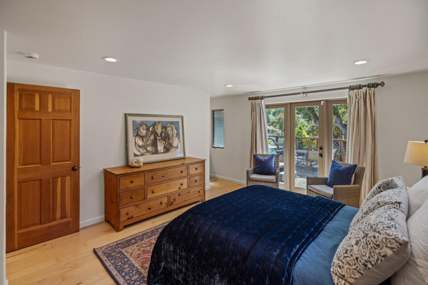 11660 McCarthy Road Carmel Valley, CA 93924 - Photo 10 of 21 a bedroom with a bed and glass window