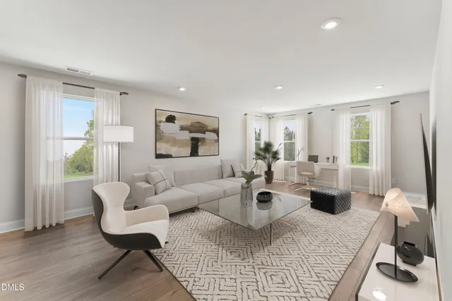 a living room with furniture rug and window