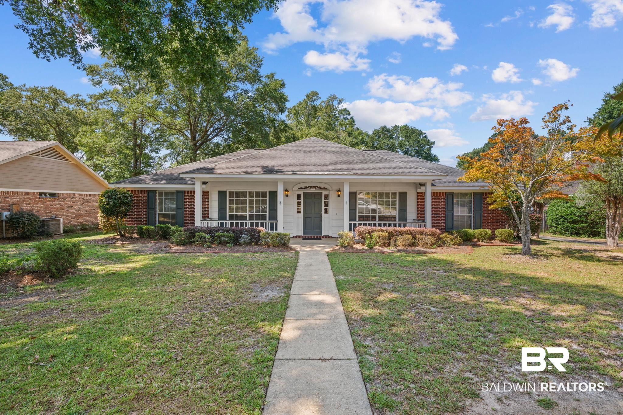 1340 Wellsley Court Mobile, AL 36695 - Photo 2 of 37 Single story home featuring covered porch, a front lawn, roof with shingles, and brick siding