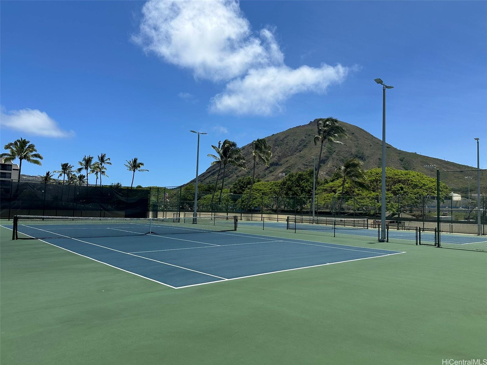 500 Lunalilo Home Road, Unit 22C Honolulu, HI 96825 - Photo 20 of 25 Tennis anyone? Pickleball for 4? Lighted at night & runs North to South.