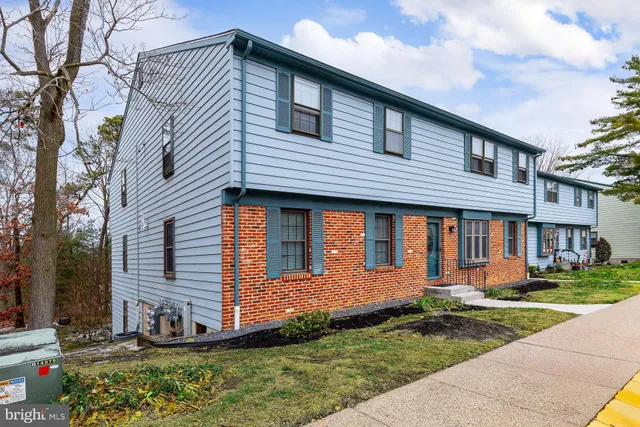 a front view of a house with garage