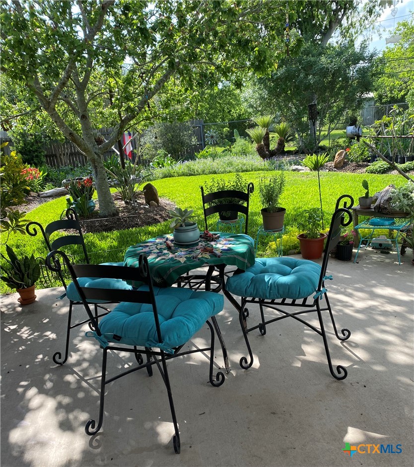 316 South Main Street Seadrift, TX 77983 - Photo 2 of 12 a backyard of a house with table and chairs