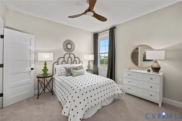 a bedroom with a bed a dresser and mirror