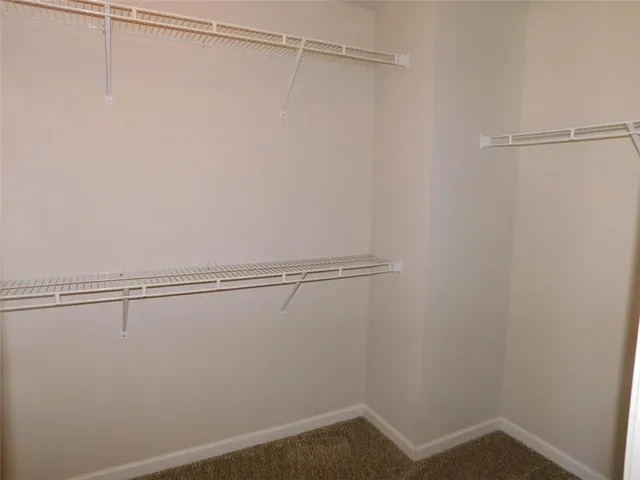 a view of an empty room and a window