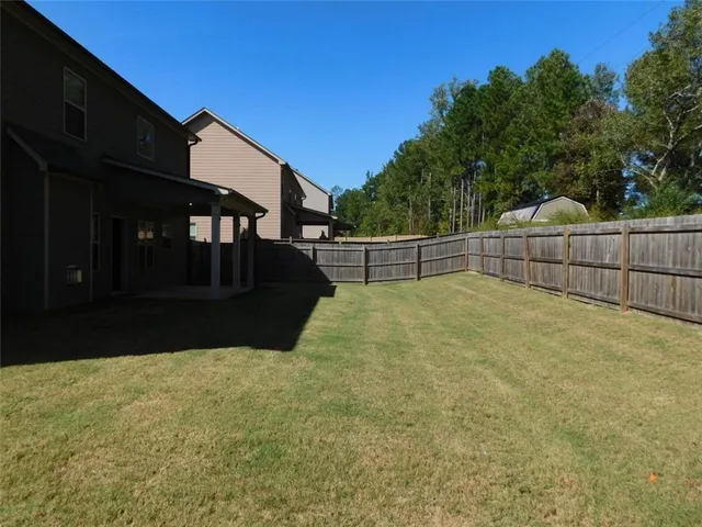 a view of a brick house with a outdoor space