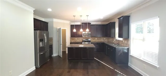 a view of a kitchen cabinets and a wooden floor