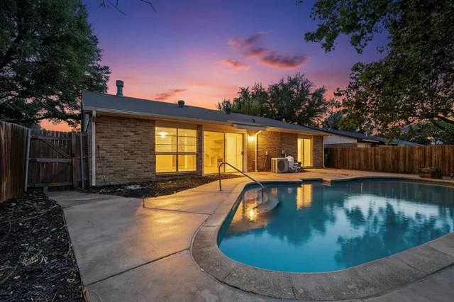 a view of a swimming pool with a patio