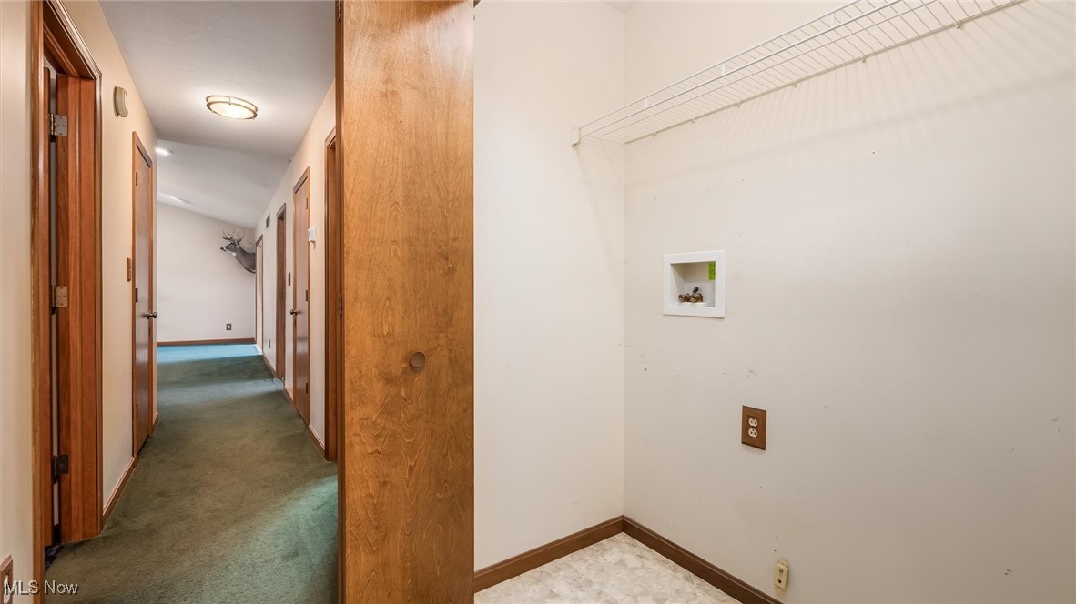 9910 Matchett Road Norwich, OH 43767 - Photo 25 of 48 Laundry area with washer hookup and carpet floors