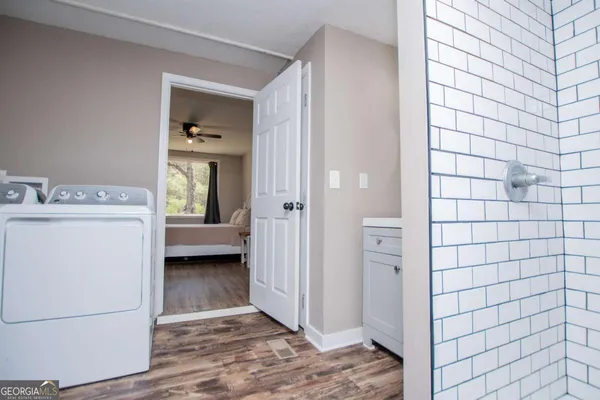 a bedroom with furniture and a window
