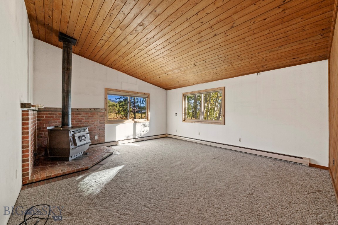 5970 Penwell Bridge Road Belgrade, MT 59714 - Photo 10 of 28 Living space with wood fireplace