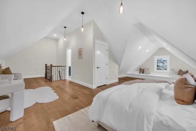 a spacious bedroom with a bed and a couch