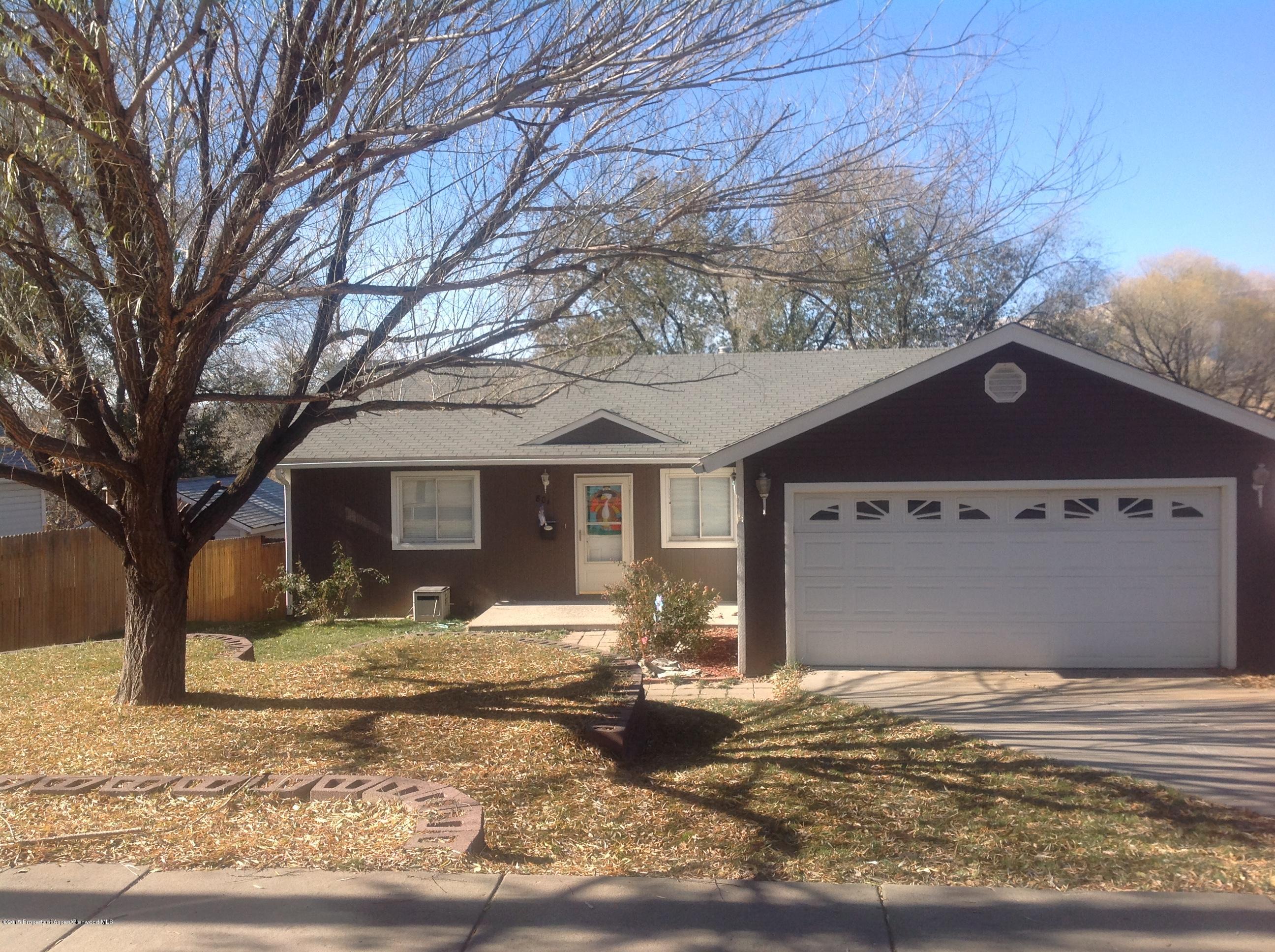 801 Whiteriver Avenue Rifle, CO 81650 - Photo 1 of 10 a view of a house with a yard covered in snow
