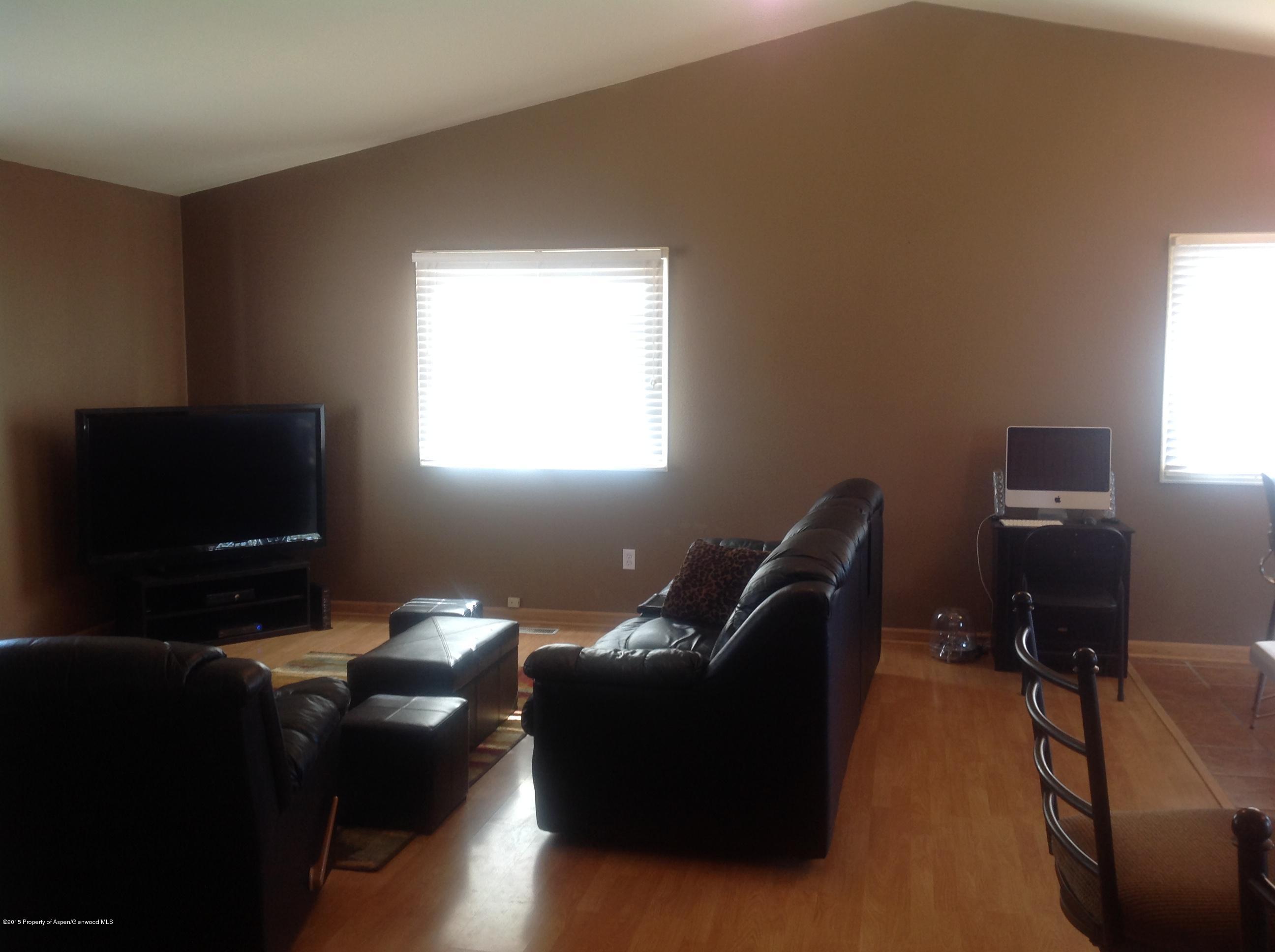 801 Whiteriver Avenue Rifle, CO 81650 - Photo 4 of 10 a living room with furniture rug and a window