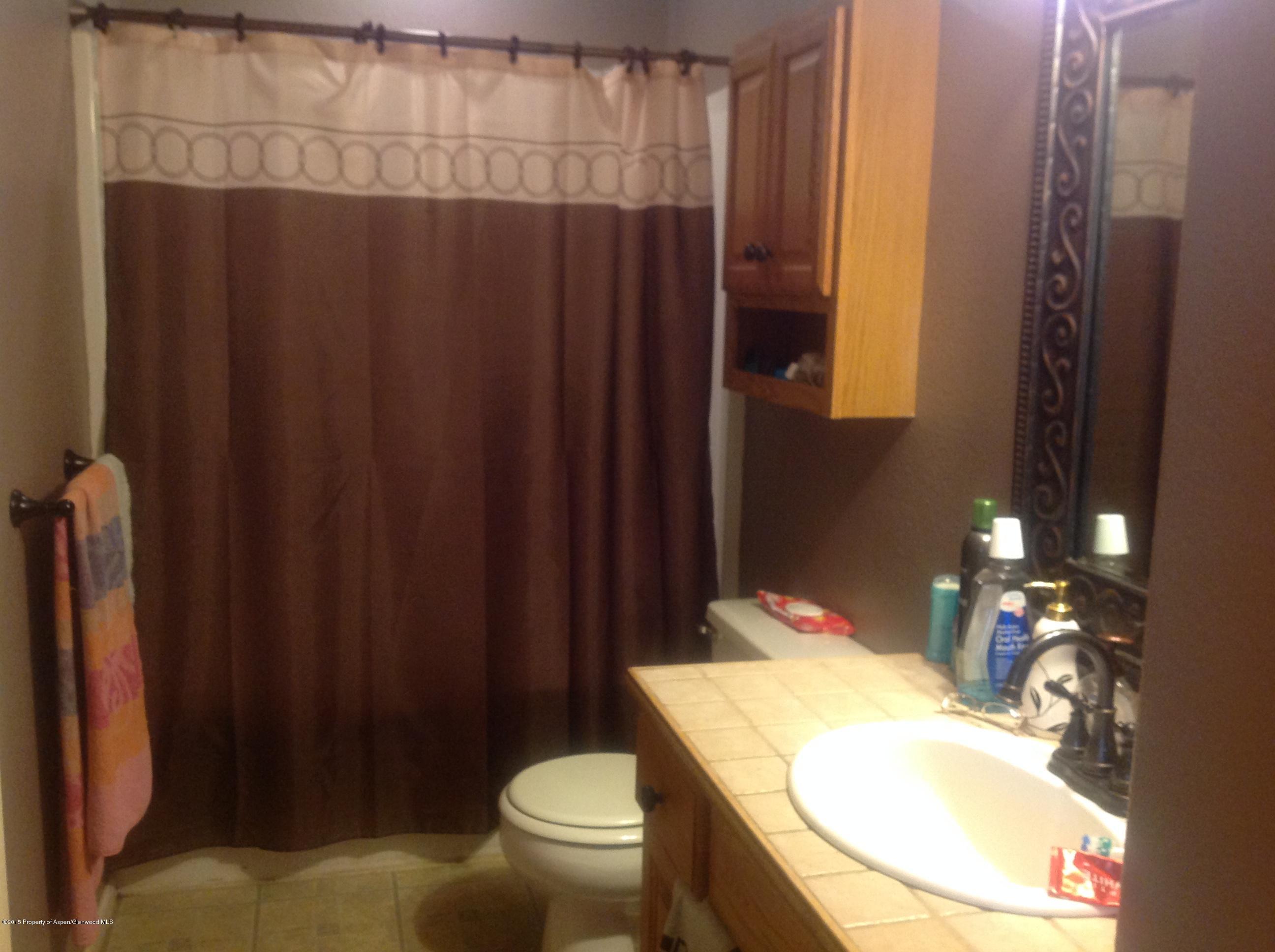 801 Whiteriver Avenue Rifle, CO 81650 - Photo 6 of 10 a bathroom with a sink and toilet