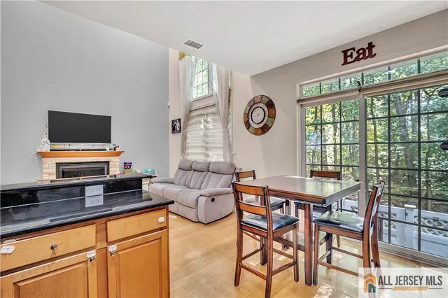 a view of a livingroom with furniture and a window