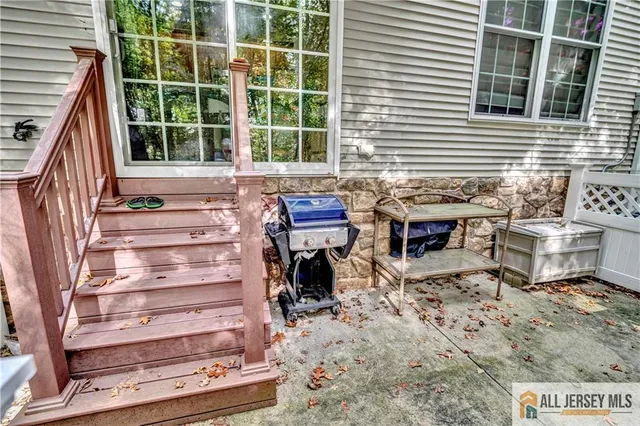 a roof deck with a table and chairs