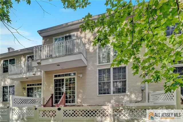 a front view of a house with large windows
