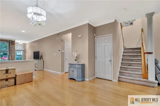 a view of a big room with closet and windows