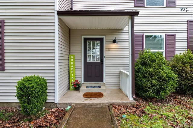a front view of a house with garden