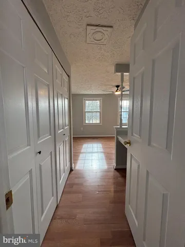 a view of gallery with wooden floor