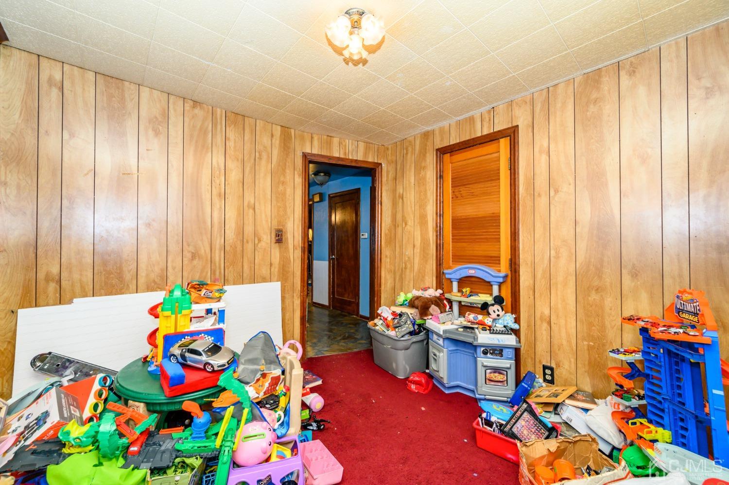 632 West Avenue Sewaren, NJ 07077 - Photo 15 of 30 a living room filled with furniture and toys