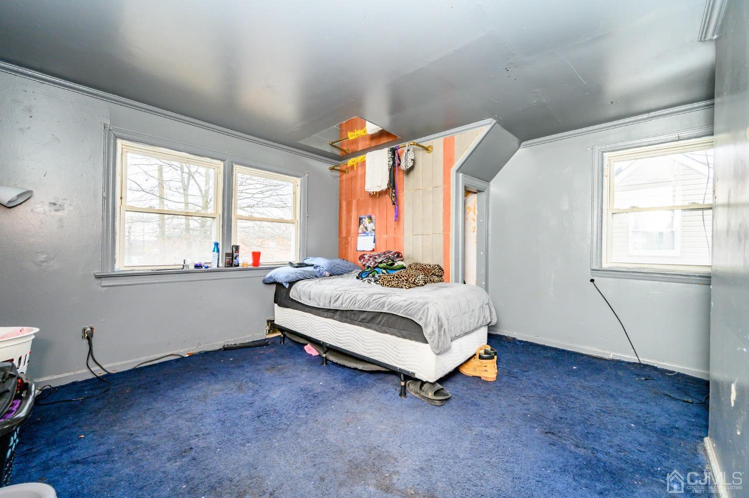 632 West Avenue Sewaren, NJ 07077 - Photo 17 of 30 a bedroom with a bed and a window