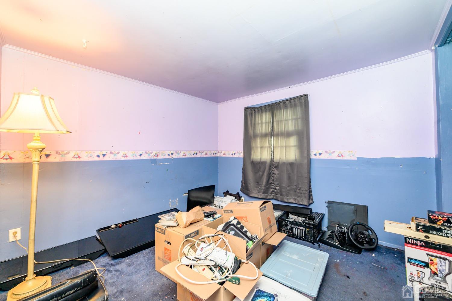 632 West Avenue Sewaren, NJ 07077 - Photo 20 of 30 a room with furniture and a window