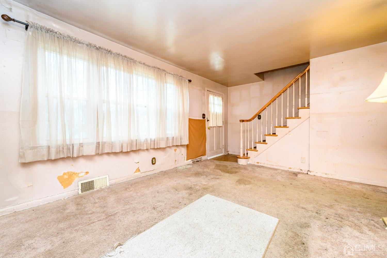 632 West Avenue Sewaren, NJ 07077 - Photo 4 of 30 a view of an empty room with a window