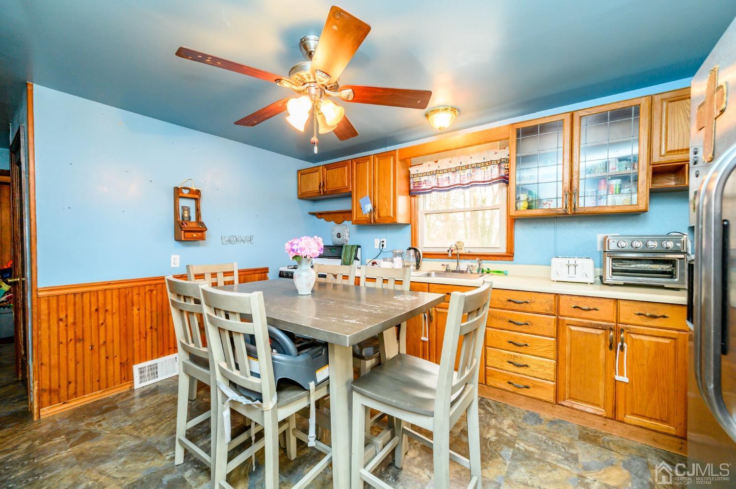 632 West Avenue Sewaren, NJ 07077 - Photo 7 of 30 a view of a dining room with furniture and a window