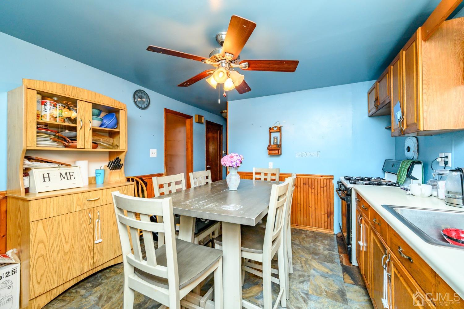 632 West Avenue Sewaren, NJ 07077 - Photo 10 of 30 a view of a dining room with furniture and a chandelier