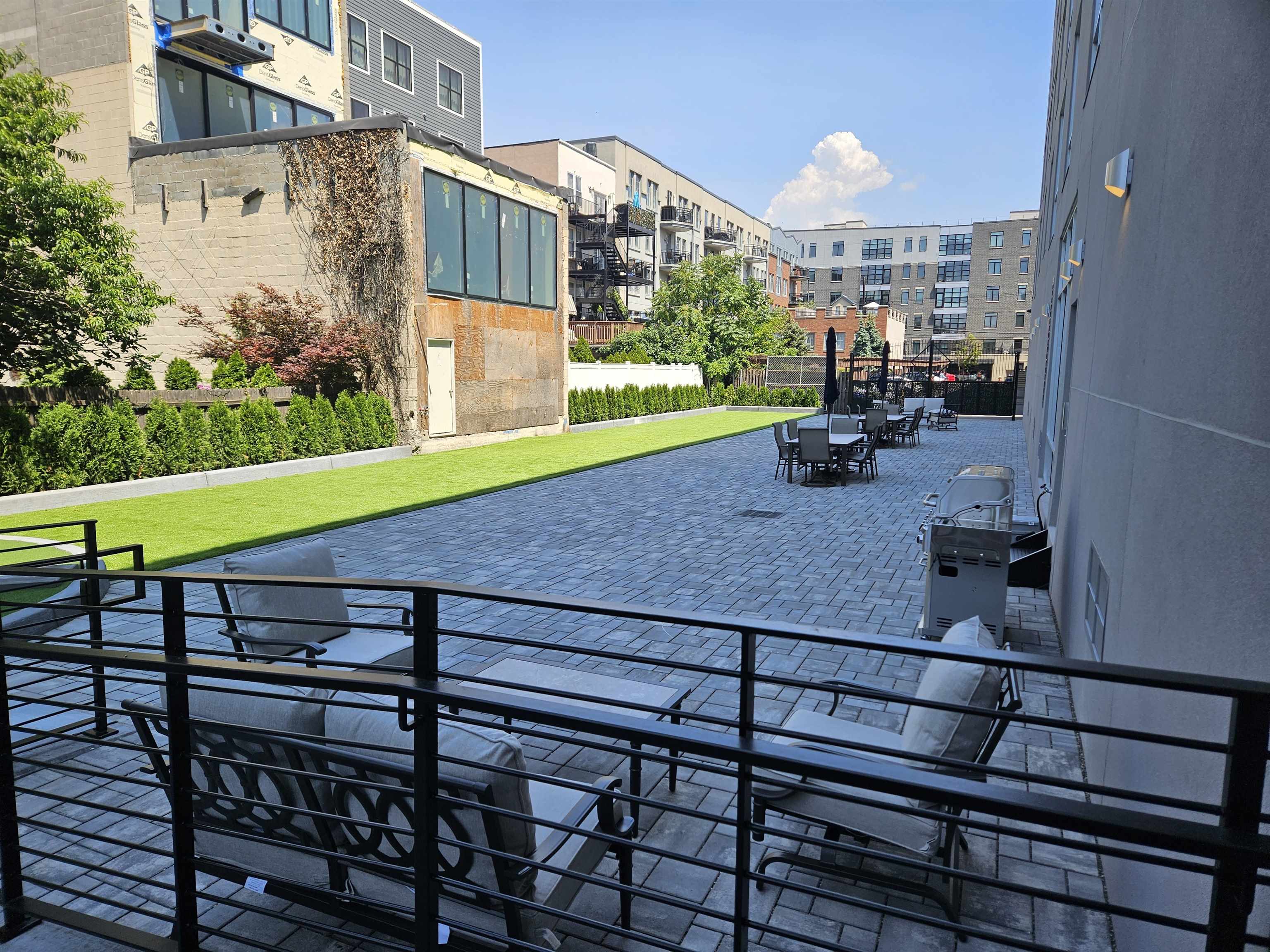 706 Madison Street, Unit 302 Hoboken, NJ 07030 - Photo 11 of 13 a view of a terrace with sitting area