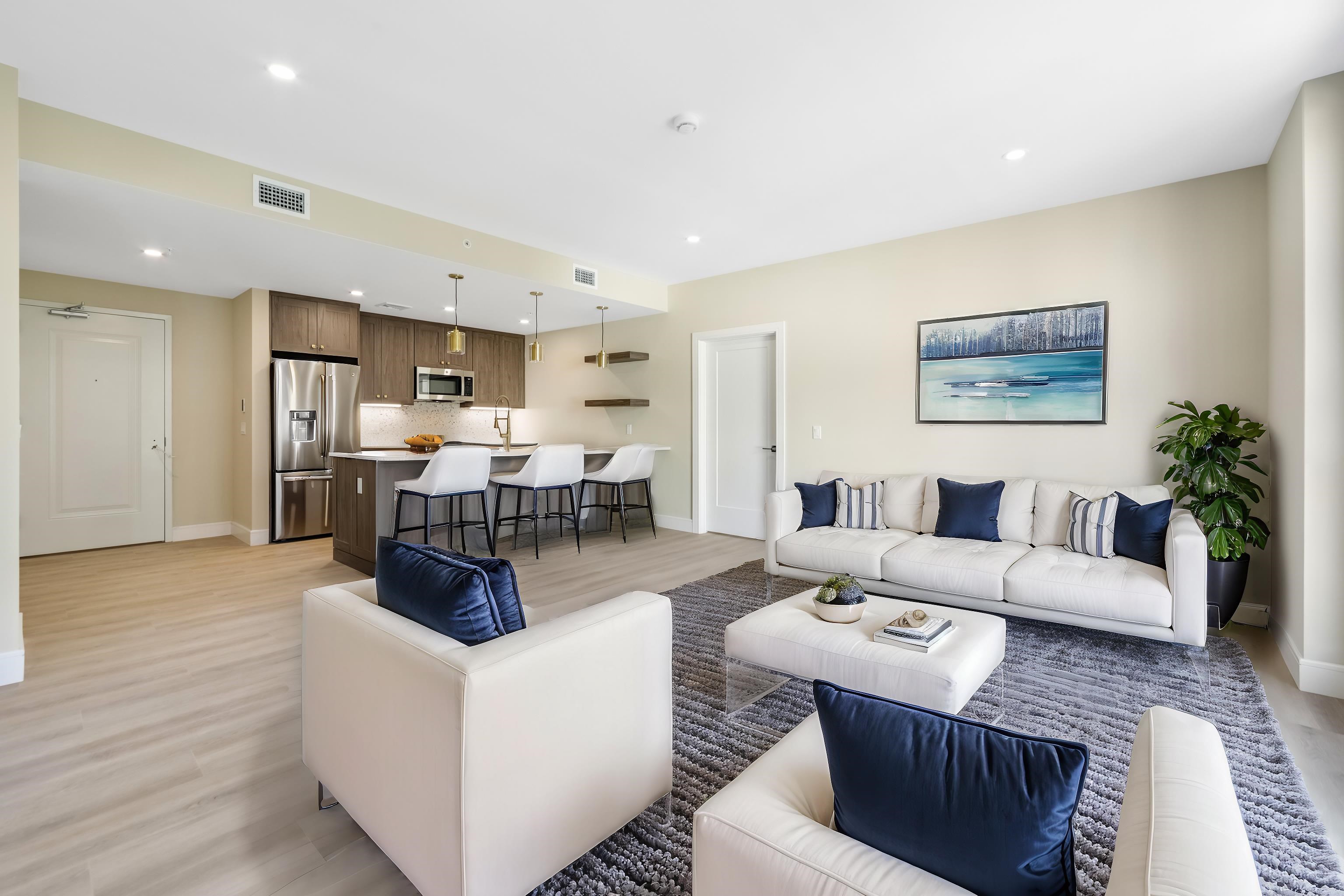 706 Madison Street, Unit 302 Hoboken, NJ 07030 - Photo 2 of 13 a living room with furniture and kitchen view
