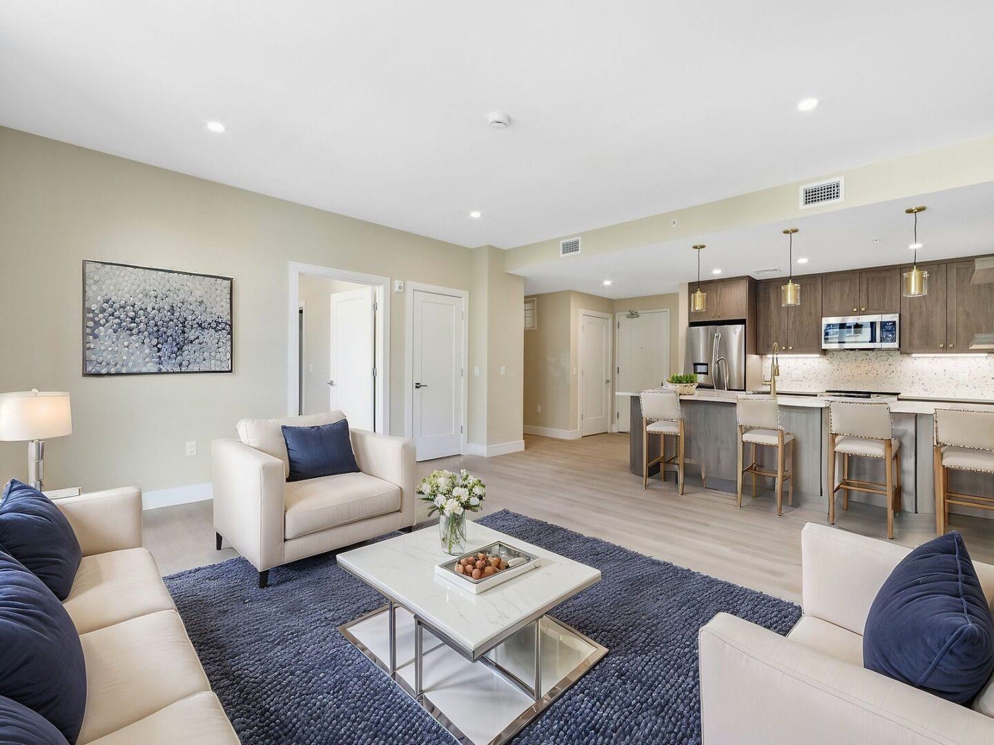 706 Madison Street, Unit 302 Hoboken, NJ 07030 - Photo 7 of 13 a living room with furniture and kitchen view