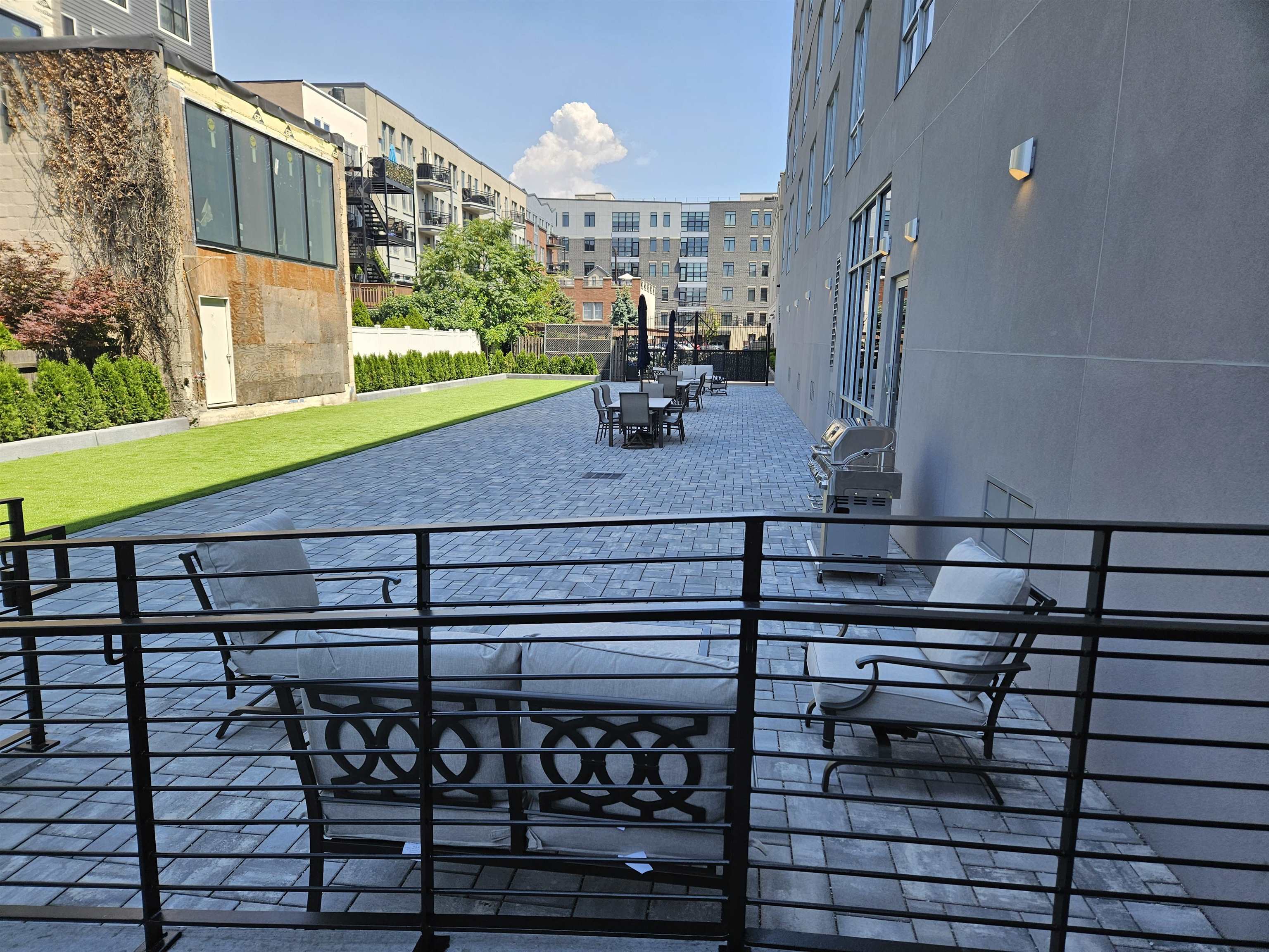 706 Madison Street, Unit 302 Hoboken, NJ 07030 - Photo 9 of 13 a view of a balcony with chairs