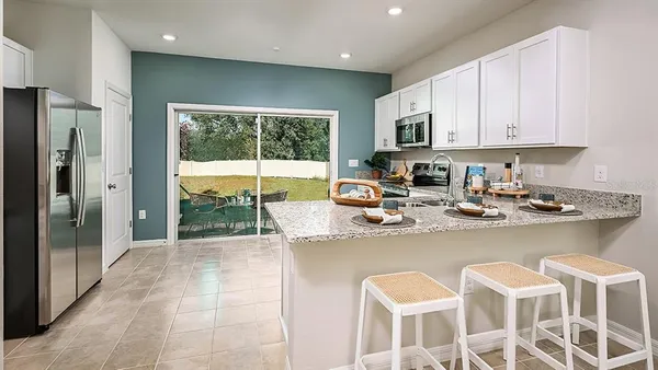 a kitchen with a sink stainless steel appliances and cabinets