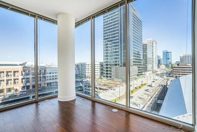 a view of a living room and hardwood floor