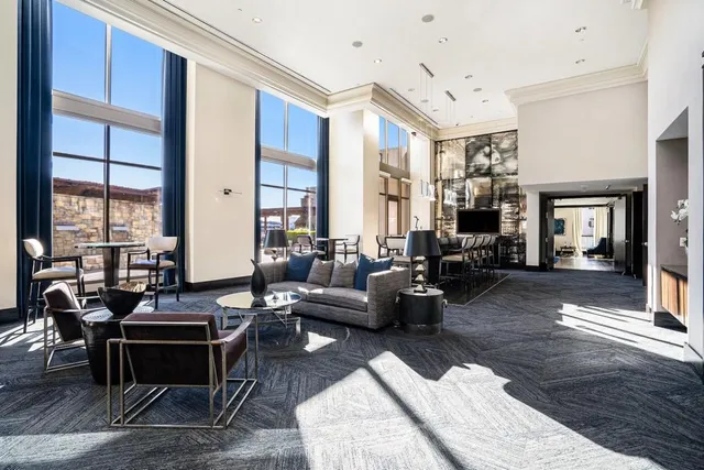 a view of a building with car parked