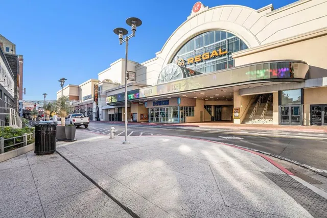 a building with car parked in front of it