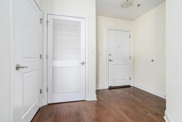 an empty room with wooden floor