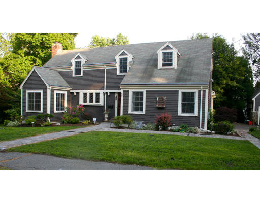 65 Hagen Road Newton, MA 02459 - Photo 1 of 17 a front view of a house with a yard