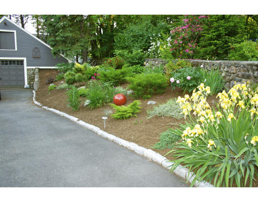 65 Hagen Road Newton, MA 02459 - Photo 4 of 17 a view of a garden and pathway