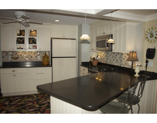 65 Hagen Road Newton, MA 02459 - Photo 9 of 17 a kitchen with a refrigerator and a stove