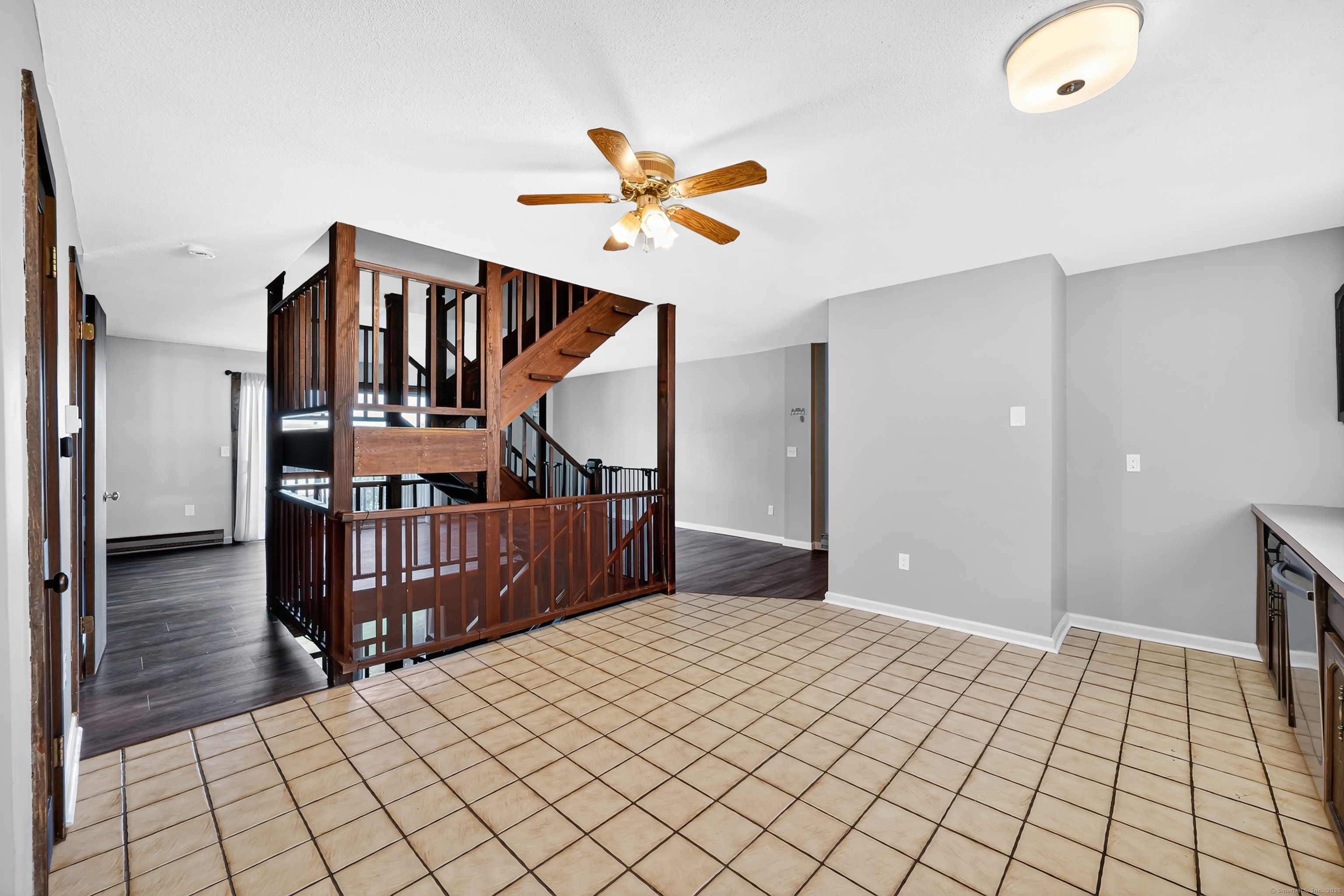 21 Pebblestone Circle, Unit 21 Suffield, CT 06078 - Photo 12 of 38 a bedroom with a bed and wooden floor