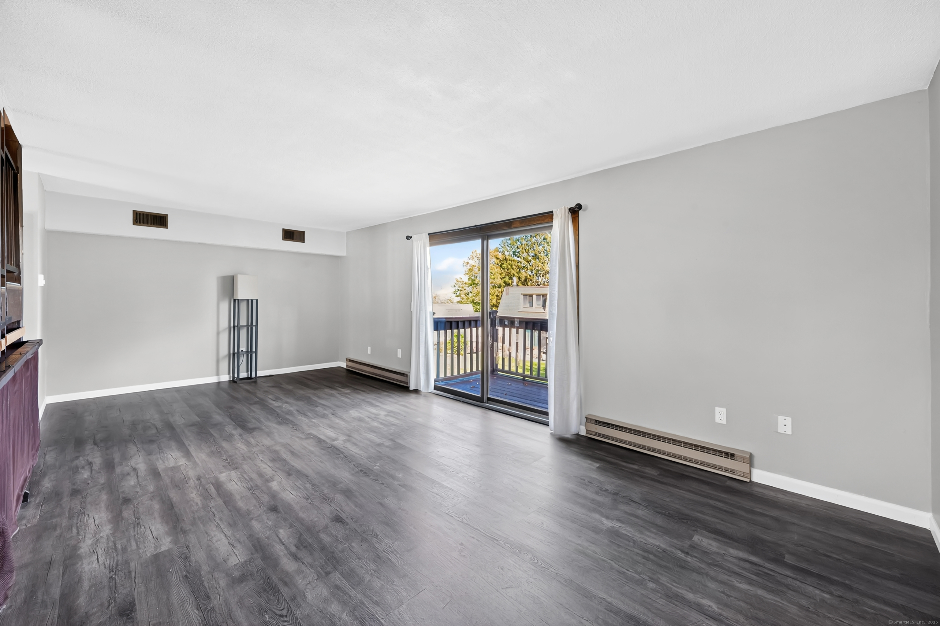 21 Pebblestone Circle, Unit 21 Suffield, CT 06078 - Photo 15 of 38 an empty room with wooden floor and windows
