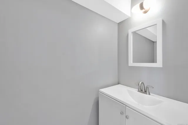 a bathroom with a sink and mirror