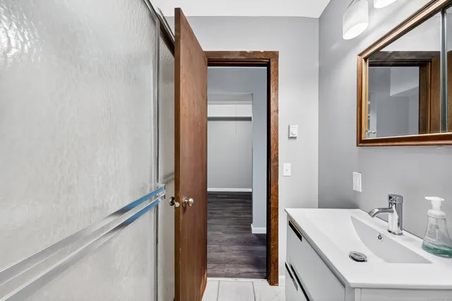 a bathroom with a sink and a mirror