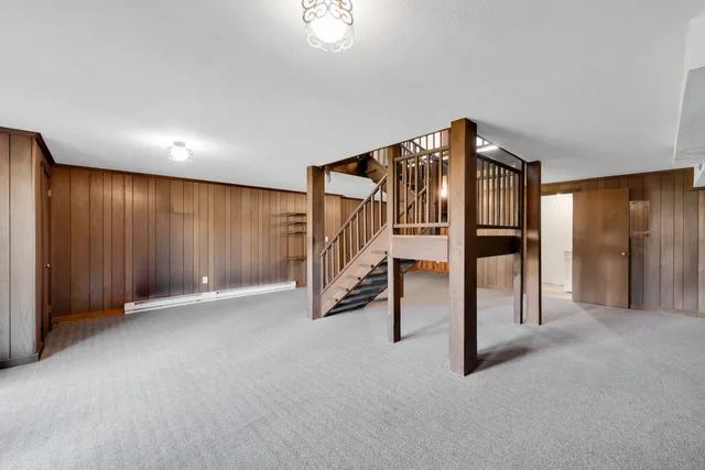 a view of an empty room with stairs