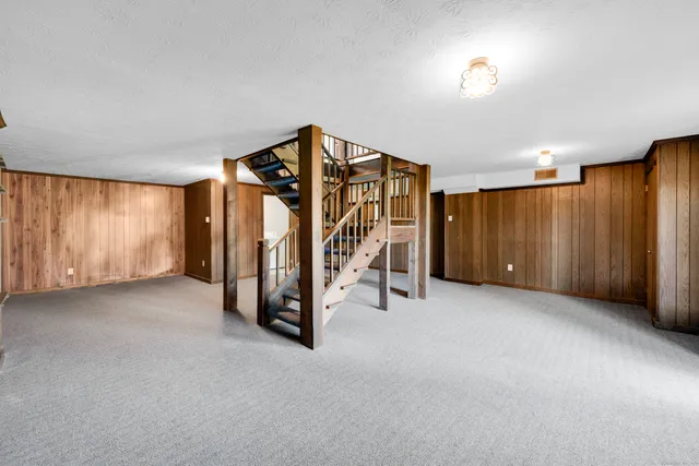 a view of an empty room with furniture