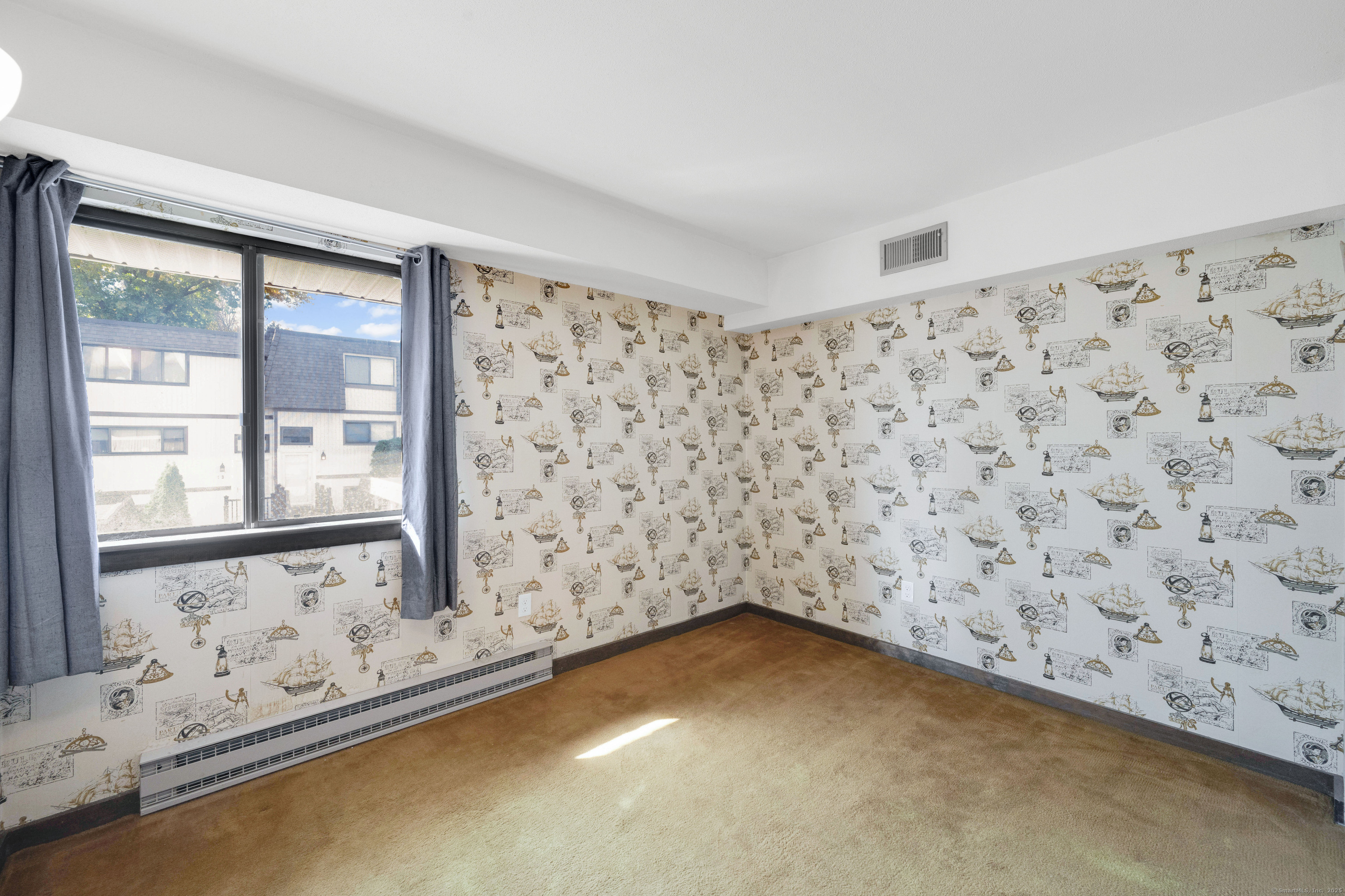21 Pebblestone Circle, Unit 21 Suffield, CT 06078 - Photo 30 of 38 a view of a livingroom with wooden floor and a window